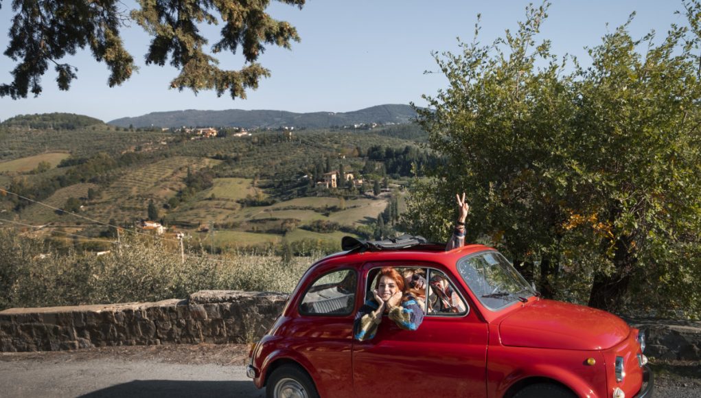 medium-shot-people-traveling-by-car
